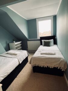 Beige and blue twin bedroom