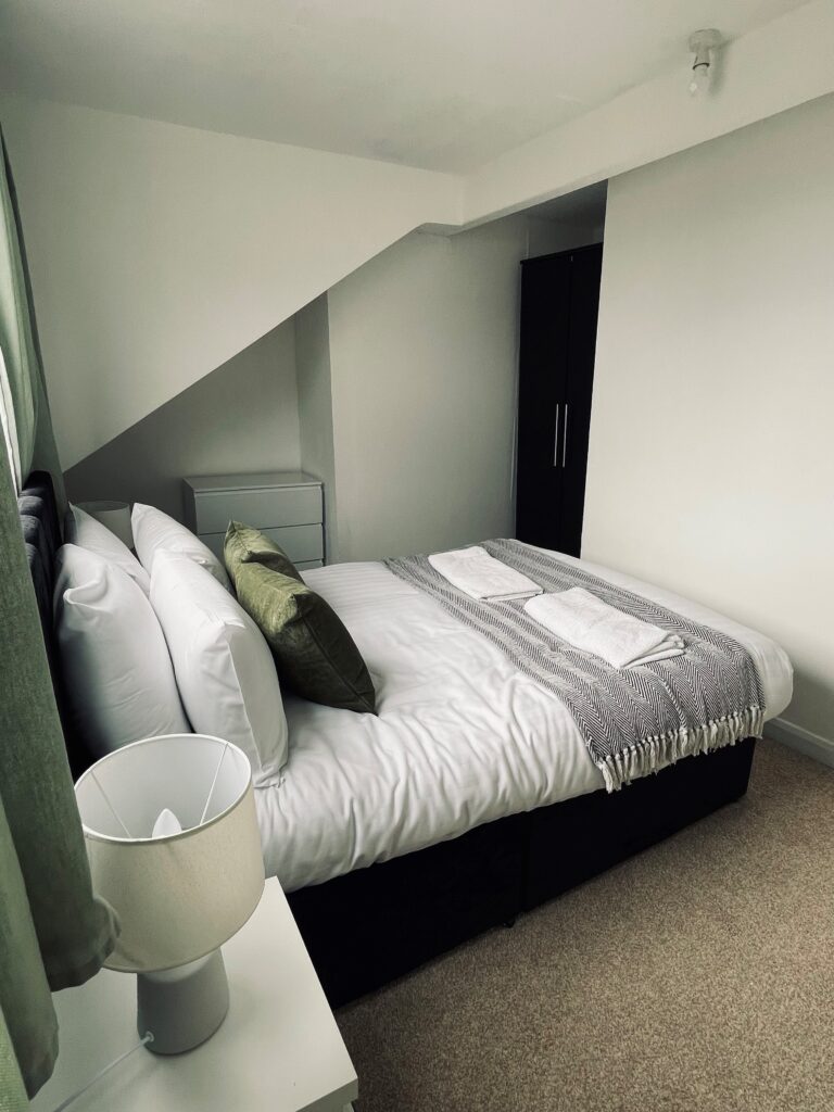 Grey and green double bedroom