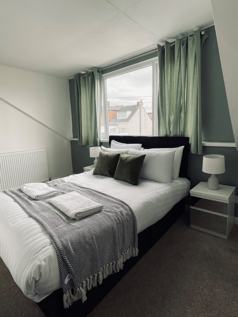 Grey and green double bedroom