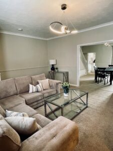 Beige living room with black coffee table