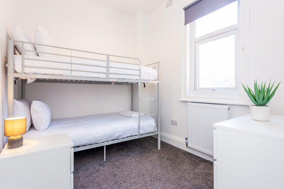 White bunk bed bedroom