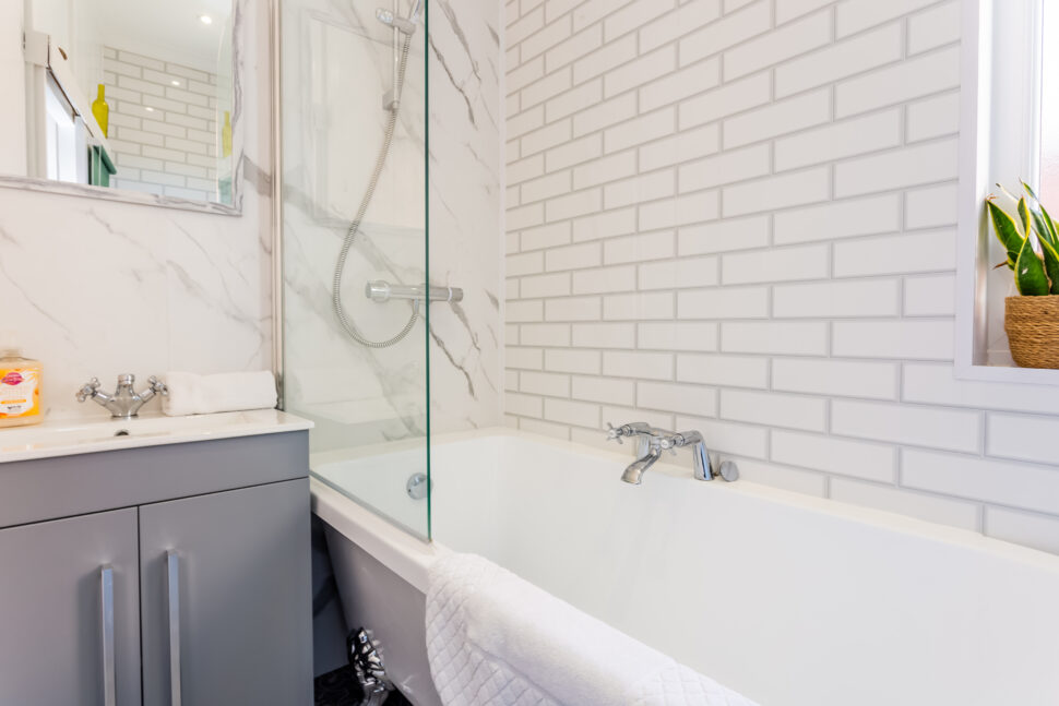 White and grey traditional shower bathroom