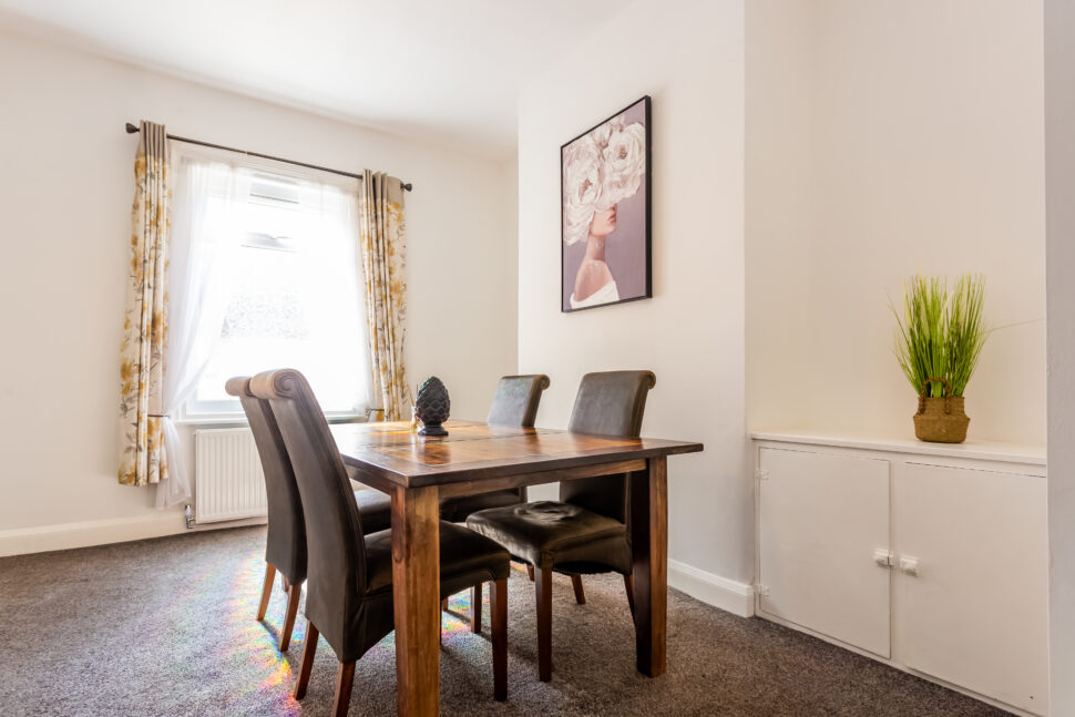 Off white dining room with oak dining table