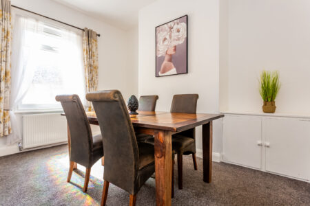 Off white dining room with oak dining table