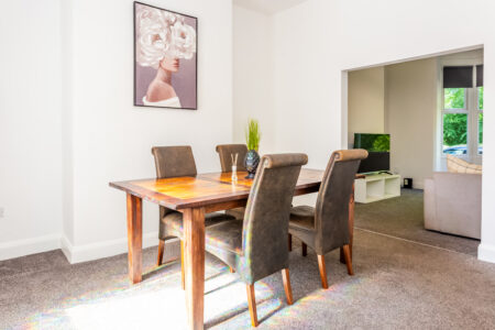 Off white dining room with oak dining table