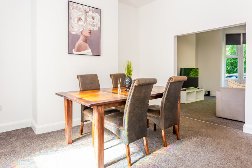 Off white dining room with oak dining table