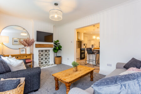 Traditional living room. Grey sofas & carpet. Oak furniture