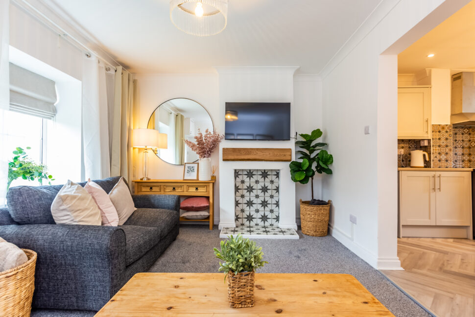 Traditional living room. Grey sofas & carpet. Oak furniture