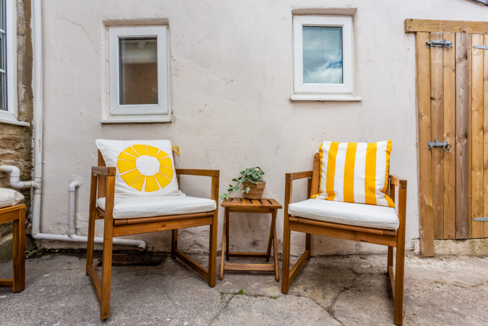 Garden patio area with outdoor wooden seating