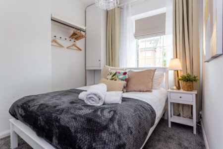 White and grey double bedroom