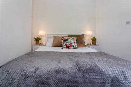 White and grey double bedroom