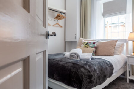 White and grey double bedroom