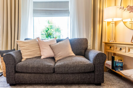 Traditional living room. Grey sofas & carpet. Oak furniture