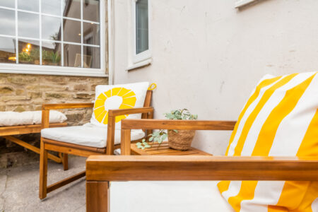 Garden patio area with outdoor wooden seating