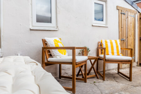 Garden patio area with outdoor wooden seating