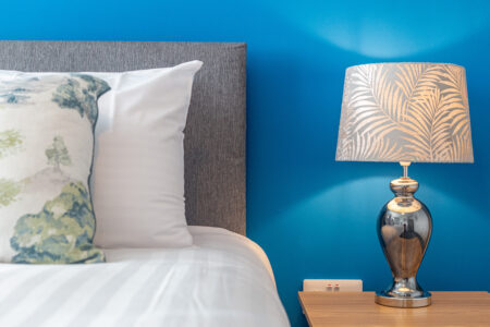 Blue king bedroom with exotic animal accessories