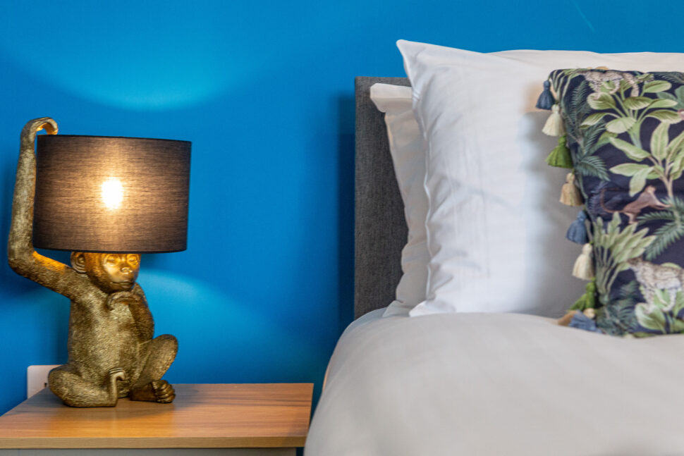 Blue king bedroom with exotic animal accessories