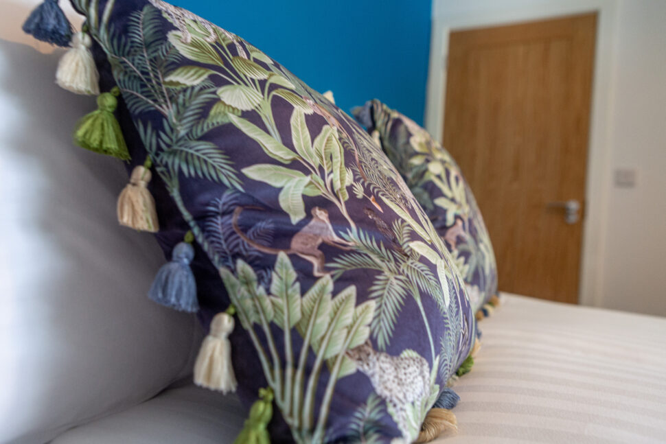 Blue king bedroom with exotic animal accessories