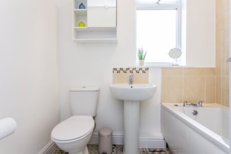 Beige tiled bathroom