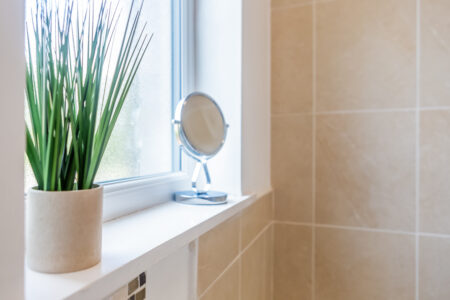 Beige tiled bathroom