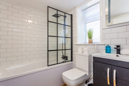 White bathroom with black accessories