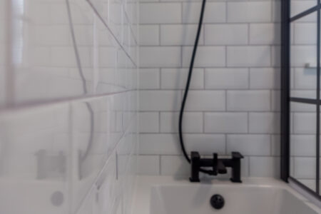 White bathroom with black accessories