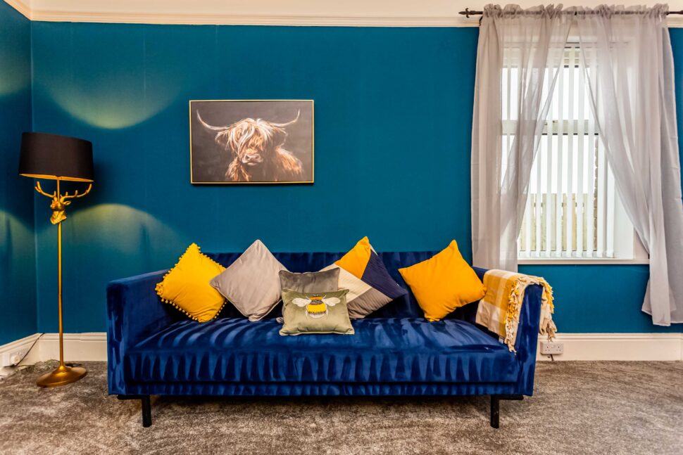 living room with blue sofas