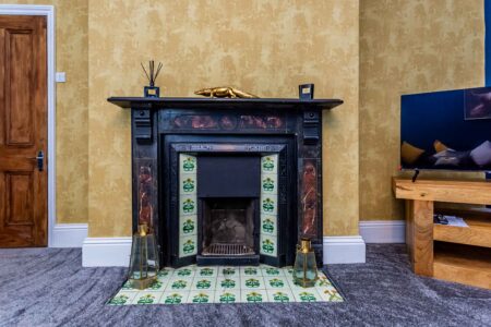 living room with blue sofas with fireplace