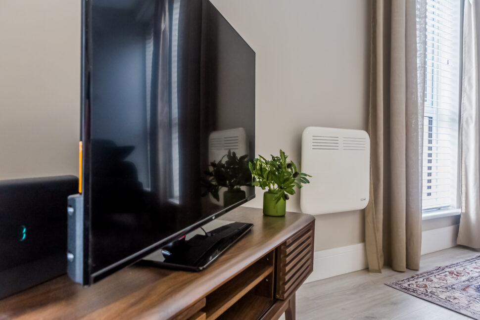 Toast Stays showing the media corner with a large flat-screen TV on a modern retro unit